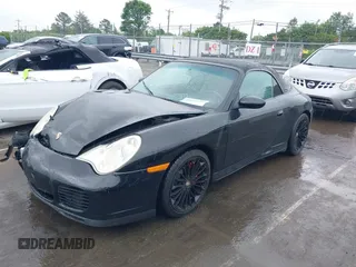 2005 Porsche 911 Carrera z VIN WP0CA299X5S650179, wystawiony jako IAAI lot #42123937 z przebiegiem 52 437 mil mil oraz . Historia ofert i sprzedaży dostępna na DreamBid. Obrazek 2.