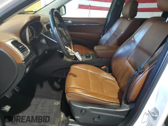 2015 Jeep Grand Cherokee Summit with VIN 1C4RJFJG1FC226591, listed as a Copart auction lot 52926115 with 130,803 mi miles and Salvage Title. Bid and sale history available at DreamBid. Image 7.