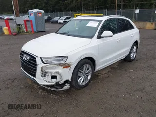 2017 Audi Q3 Premium with VIN WA1ECCFS5HR003565, listed as a IAAI auction lot 42140711 with 74,034 mi miles and . Bid and sale history available at DreamBid. Image 2.