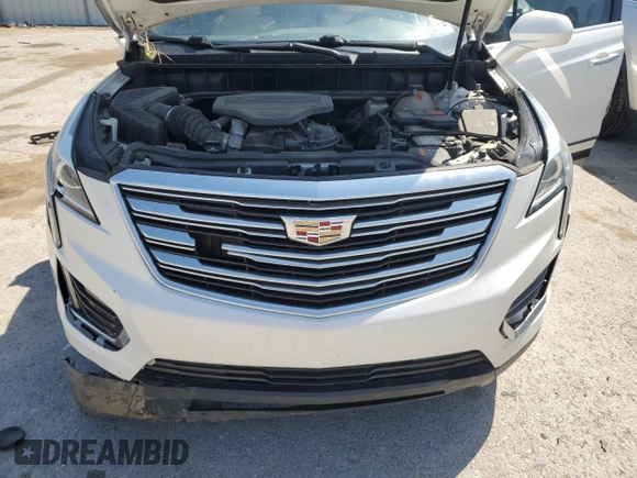 2017 Cadillac XT5 FWD z VIN 1GYKNARS3HZ297366, wystawiony jako Copart lot #53908815 z przebiegiem 95 834 mil mil oraz Szkoda całkowita • Salvage title. Historia ofert i sprzedaży dostępna na DreamBid. Obrazek 12.