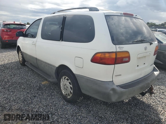 2000 Toyota Sienna CE with VIN 4T3GF19C0YU294779, listed as a Copart auction lot 74715024 with 164,664 mi miles and Salvage Title. Bid and sale history available at carsss.com. Image 2.