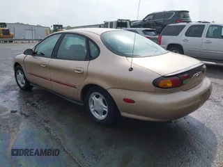 1997 Ford Taurus GL z VIN 1FALP52U2VA273762, wystawiony jako IAAI lot #41956536 z przebiegiem 177 340 mil mil oraz . Historia ofert i sprzedaży dostępna na DreamBid. Obrazek 3.