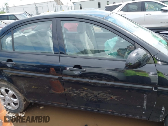 2006 Hyundai Accent GLS z VIN KMHCN46C76U038040, wystawiony jako IAAI lot #42220455 z przebiegiem 140 413 mil mil oraz . Historia ofert i sprzedaży dostępna na DreamBid. Obrazek 14.