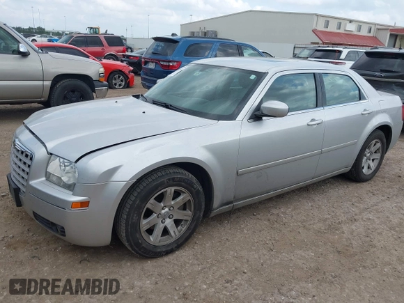 2006 Chrysler 300 Touring with VIN 2C3KA53GX6H113815, listed as a IAAI auction lot 42149912 with 144,813 mi miles. Bid and sale history available at carsss.com. Image 2.