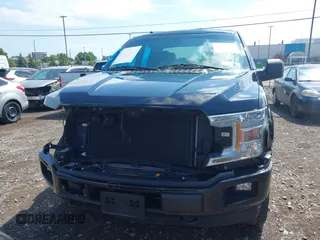 2018 Ford F-150 XL with VIN 1FTEX1EP5JKG01004, listed as a IAAI auction lot 42583232 with 123,258 mi miles and . Bid and sale history available at DreamBid. Image 12.