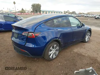2023 Tesla Model Y Long Range with VIN 7SAYGDEE6PF947827, listed as a IAAI auction lot 41443524 with 12,381 mi miles and . Bid and sale history available at DreamBid. Image 4.