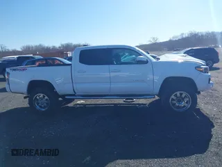 2021 Toyota Tacoma 4WD SR5 with VIN 3TYDZ5BN4MT000619, listed as a IAAI auction lot 41886686 with 91,338 mi miles. Bid and sale history available at carsss.com. Image 12.