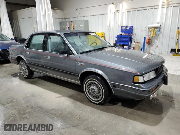 1991 Oldsmobile Cutlass Ciera with VIN 2G3AM54N8M2304905, listed as a Copart auction lot 52047535 with 28,749 mi miles and Salvage Title. Bid and sale history available at DreamBid. Image 4.