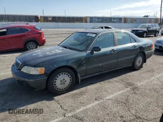 1996 Acura RL with VIN JH4KA965XTC009917, listed as a Copart auction lot 65083665 with 197,486 mi miles and Salvage title. Bid and sale history available at DreamBid. Image 1.