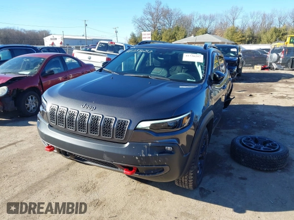 2022 Jeep Cherokee Trailhawk with VIN 1C4PJMBX9ND522235, listed as a IAAI auction lot 41738257 with 24,911 mi miles and . Bid and sale history available at DreamBid. Image 2.