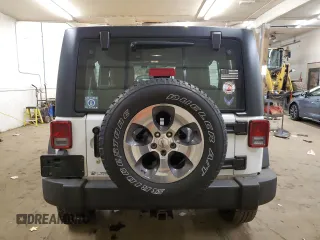 2018 Jeep Wrangler JK Unlimited Sport S with VIN 1C4BJWDG8JL828961, listed as a Copart auction lot 80446474 with 74,577 mi miles and Salvage Title. Bid and sale history available at carsss.com. Image 6.