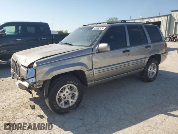 1998 Jeep Grand Cherokee Limited with VIN 1J4GZ78S5WC325148, listed as a Copart auction lot 67780424 with Not provided miles and Salvage title. Bid and sale history available at DreamBid. Image 1.