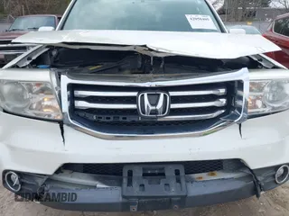 2014 Honda Pilot Touring with VIN 5FNYF4H91EB041614, listed as a IAAI auction lot 42050405 with 158,236 mi miles and . Bid and sale history available at DreamBid. Image 6.