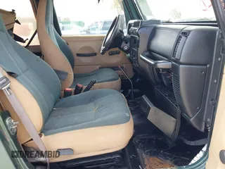 2000 Jeep Wrangler Sahara with VIN 1J4FA59SXYP743190, listed as a IAAI auction lot 41699142 with 1 mi miles. Bid and sale history available at carsss.com. Image 5.
