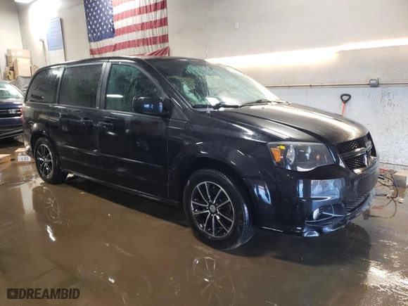 2014 Dodge Grand Caravan SXT with VIN 2C4RDGCG4ER104887, listed as a Copart auction lot 48569215 with 126,910 mi miles and Salvage Title. Bid and sale history available at carsss.com. Image 4.