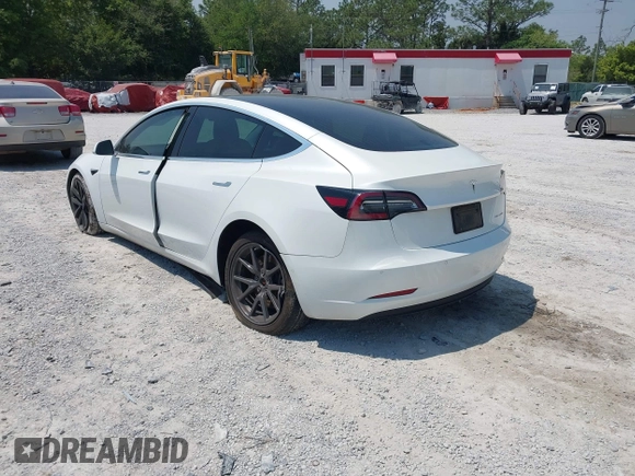 2019 Tesla Model 3 Long Range with VIN 5YJ3E1EB4KF494432, listed as a IAAI auction lot 42009327 with 121,954 mi miles and . Bid and sale history available at DreamBid. Image 3.