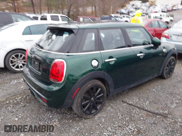 2016 MINI Cooper Hardtop 4 Door S with VIN WMWXU3C58G2D31595, listed as a IAAI auction lot 41267547 with 145,191 mi miles. Bid and sale history available at carsss.com. Image 4.