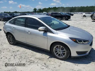 2017 Ford Focus SE with VIN 1FADP3F27HL223918, listed as a Copart auction lot 57464685 with 134,253 mi miles and Salvage title. Bid and sale history available at DreamBid. Image 4.