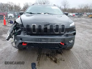 2016 Jeep Cherokee Trailhawk with VIN 1C4PJMBS6GW113069, listed as a IAAI auction lot 41757725 with 125,029 mi miles. Bid and sale history available at carsss.com. Image 13.