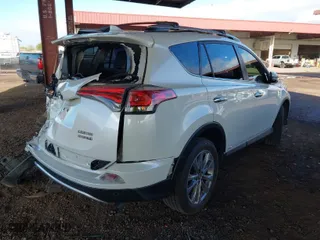 2016 Toyota RAV4 Hybrid Limited with VIN JTMDJREV6GD016181, listed as a IAAI auction lot 41616922 with 95,037 mi miles. Bid and sale history available at carsss.com. Image 4.