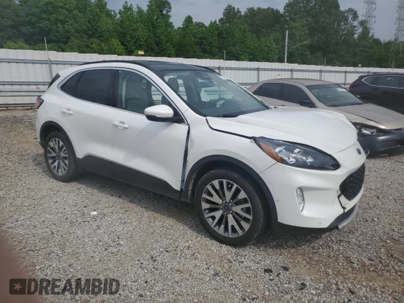 2020 Ford Escape Titanium z VIN 1FMCU9J9XLUB57675, wystawiony jako Copart lot #57777795 z przebiegiem Nie podano mil oraz Szkoda całkowita • Salvage title. Historia ofert i sprzedaży dostępna na DreamBid. Obrazek 4.