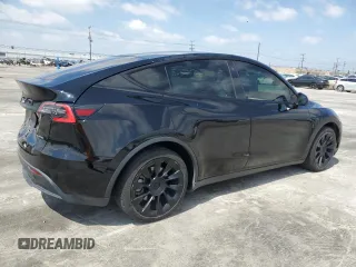 2020 Tesla Model Y Long Range with VIN 5YJYGDEE6LF051549, listed as a Copart auction lot 55063805 with 77,861 mi miles and Salvage Title. Bid and sale history available at DreamBid. Image 3.