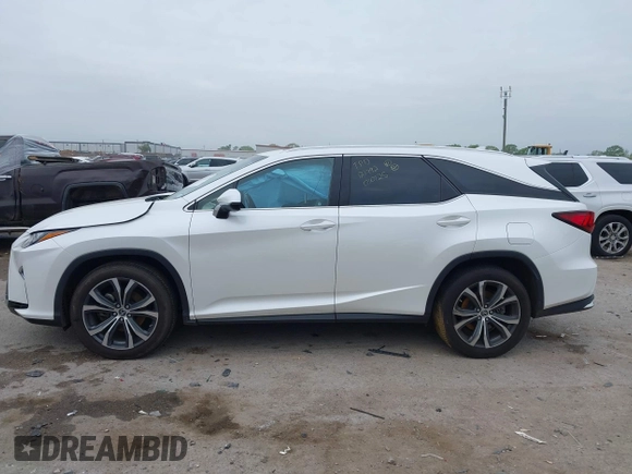 2018 Lexus RX 350L Premium z VIN JTJDZKCAXJ2010125, wystawiony jako IAAI lot #41899420 z przebiegiem 113 995 mil mil oraz . Historia ofert i sprzedaży dostępna na DreamBid. Obrazek 14.