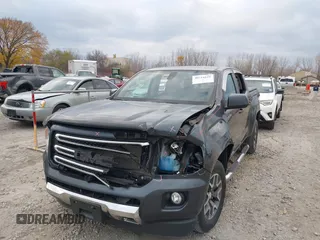 2016 GMC Canyon 4WD SLE with VIN 1GTG6CE38G1165896, listed as a IAAI auction lot 40716621 with 116,684 mi miles. Bid and sale history available at carsss.com. Image 6.