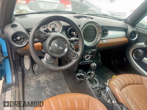 2014 MINI Convertible S z VIN WMWZP3C57ET706977, wystawiony jako Copart lot #45777855 z przebiegiem 77 175 mil mil oraz Czysty tytuł • Clean title. Historia ofert i sprzedaży dostępna na DreamBid. Obrazek 9.