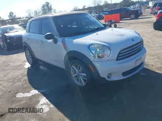 2013 MINI Cooper Countryman with VIN WMWZB3C55DWR36061, listed as a IAAI auction lot 41666672 with 155,222 mi miles. Bid and sale history available at carsss.com. Image 1.