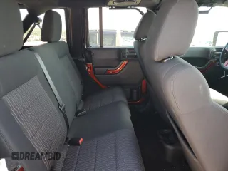 2012 Jeep Wrangler Unlimited Sport with VIN 1C4BJWDG0CL200802, listed as a Copart auction lot 63822365 with 116,501 mi miles and Salvage title. Bid and sale history available at DreamBid. Image 11.