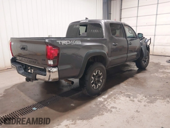 2019 Toyota Tacoma SR with VIN 5TFCZ5AN7KX208672, listed as a IAAI auction lot 42143071 with 83,584 mi miles and . Bid and sale history available at DreamBid. Image 4.