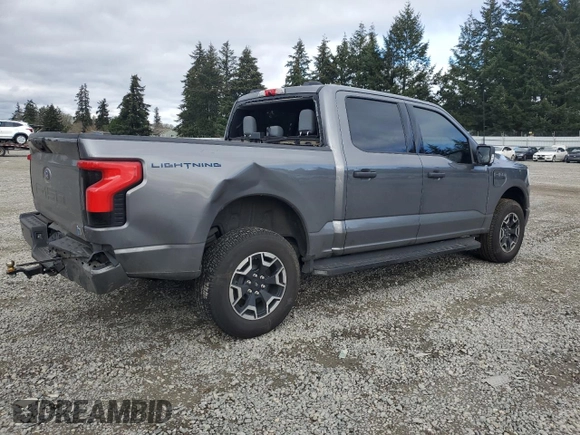 2023 Ford F-150 Lightning Pro with VIN 1FTVW1EL8PWG38419, listed as a Copart auction lot 47630535 with 11,940 mi miles and Salvage Title. Bid and sale history available at DreamBid. Image 3.