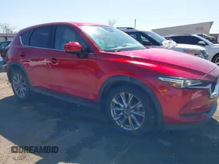 2019 Mazda CX-5 Grand Touring with VIN JM3KFADM5K1556917, listed as a IAAI auction lot 41706323 with 77,804 mi miles. Bid and sale history available at carsss.com. Image 1.