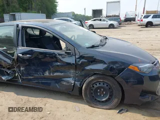 2018 Toyota Corolla L with VIN 2T1BURHE1JC052651, listed as a IAAI auction lot 42430958 with 104,664 mi miles and . Bid and sale history available at DreamBid. Image 6.