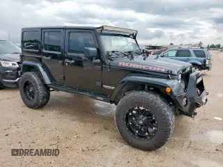 2015 Jeep Wrangler Unlimited Rubicon Hard Rock with VIN 1C4HJWFG1FL710264, listed as a Copart auction lot 54123285 with 96,737 mi miles and Salvage title. Bid and sale history available at DreamBid. Image 4.