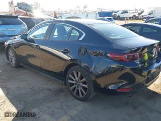 2022 Mazda Mazda3 Sedan Carbon Edition with VIN JM1BPACLXN1507604, listed as a IAAI auction lot 41408768 with 77,239 mi miles. Bid and sale history available at carsss.com. Image 3.