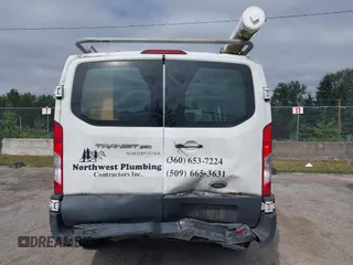 2015 Ford Transit Cargo with VIN 1FTNR1ZM6FKA34609, listed as a IAAI auction lot 42635875 with 214,750 mi miles and . Bid and sale history available at DreamBid. Image 16.