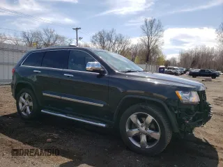 2013 Jeep Grand Cherokee Overland with VIN 1C4RJFCT2DC576125, listed as a Copart auction lot 52595165 with 100,361 mi miles and Salvage Title. Bid and sale history available at carsss.com. Image 4.