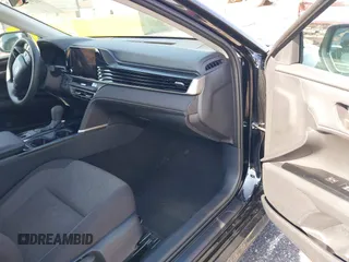 2025 Toyota Camry LE with VIN 4T1DAACK7SU518065, listed as a IAAI auction lot 41974635 with 17,279 mi miles and . Bid and sale history available at DreamBid. Image 5.