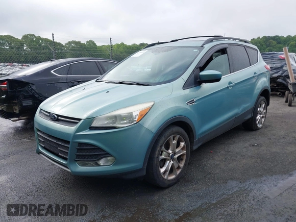 2013 Ford Escape SE with VIN 1FMCU9GX5DUD51120, listed as a IAAI auction lot 42196923 with 183,386 mi miles and . Bid and sale history available at DreamBid. Image 2.