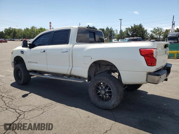 2016 Nissan Titan Platinum Reserve z VIN 1N6BA1F41GN504539, wystawiony jako Copart lot #64812975 z przebiegiem 143 144 mil mil oraz Szkoda całkowita • Salvage title. Historia ofert i sprzedaży dostępna na DreamBid. Obrazek 2.