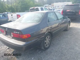 2000 Toyota Camry CE z VIN JT2BG28K3Y0513835, wystawiony jako IAAI lot #42309937 z przebiegiem 132 572 mil mil oraz . Historia ofert i sprzedaży dostępna na DreamBid. Obrazek 4.