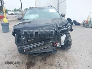 2021 Jeep Cherokee Trailhawk with VIN 1C4PJMBX0MD167941, listed as a IAAI auction lot 42507379 with 70,414 mi miles and . Bid and sale history available at DreamBid. Image 6.