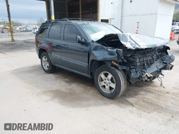2007 Jeep Grand Cherokee Laredo with VIN 1J8GR48K07C692148, listed as a IAAI auction lot 42079608 with 245,605 mi miles. Bid and sale history available at carsss.com. Image 1.