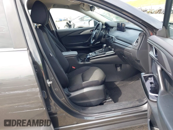 2021 Mazda CX-9 Sport with VIN JM3TCBBY7M0520437, listed as a IAAI auction lot 42022562 with 77,063 mi miles and . Bid and sale history available at DreamBid. Image 5.