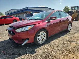 2016 Ford Focus Titanium z VIN 1FADP3J22GL357984, wystawiony jako Copart lot #64552975 z przebiegiem 142 788 mil mil oraz Nie do naprawy • Non repairable. Historia ofert i sprzedaży dostępna na DreamBid. Obrazek 1.