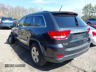 2013 Jeep Grand Cherokee Laredo with VIN 1C4RJFAG1DC592371, listed as a IAAI auction lot 42064993 with 136,154 mi miles. Bid and sale history available at carsss.com. Image 3.