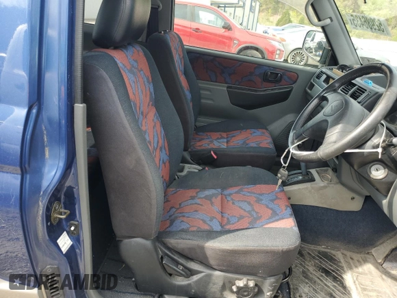 1999 Mitsubishi Montero z VIN H58A0013724, wystawiony jako Copart lot #52986435 z przebiegiem 88 711 mil mil oraz Szkoda całkowita • Salvage title. Historia ofert i sprzedaży dostępna na DreamBid. Obrazek 7.