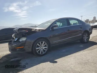 2010 Volkswagen Passat Komfort with VIN WVWJK7ANXAE129739, listed as a Copart auction lot 57798275 with 155,830 mi miles and Salvage title. Bid and sale history available at DreamBid. Image 1.